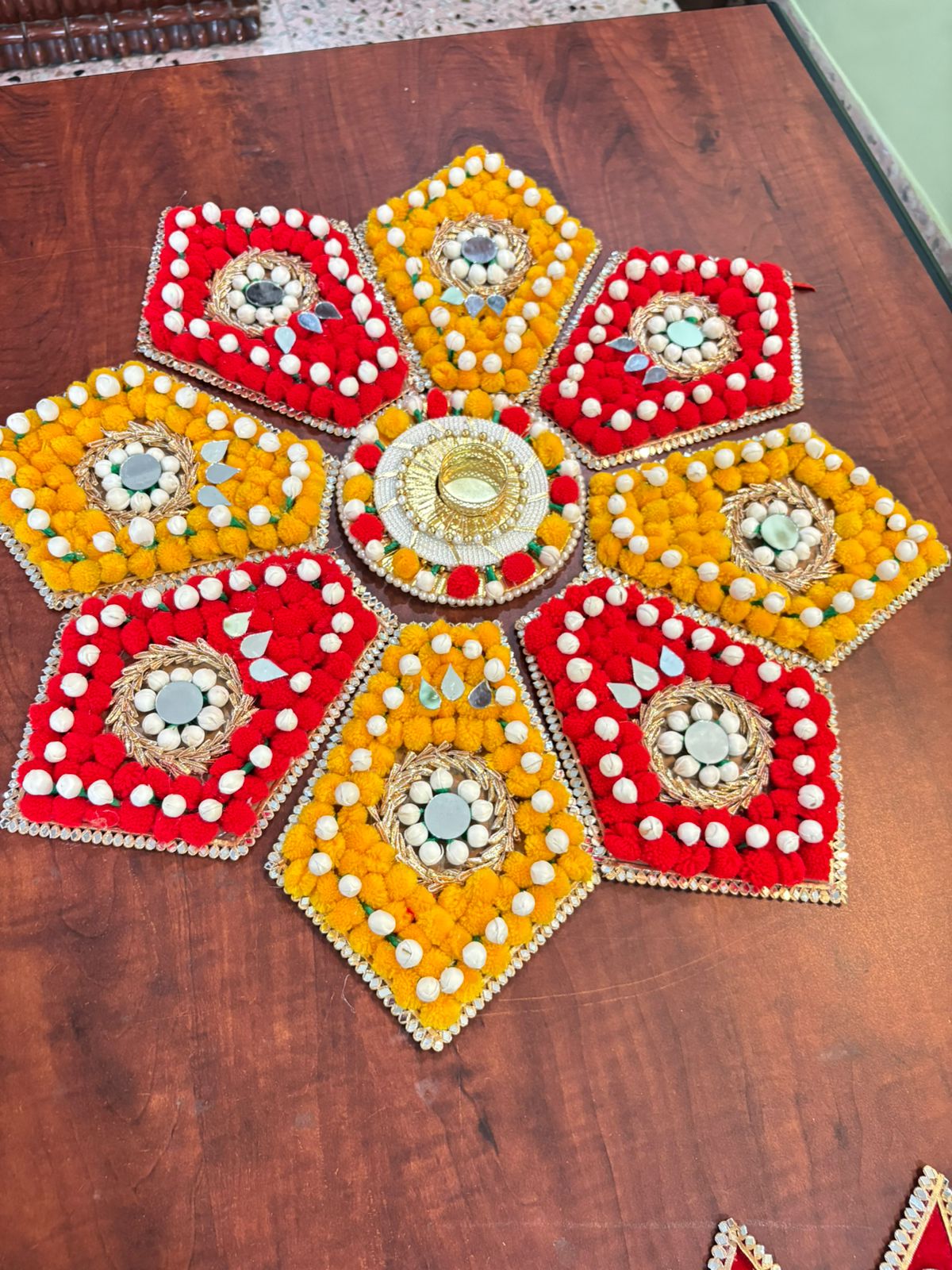 Red Yellow 8 Petal Flower Rangoli