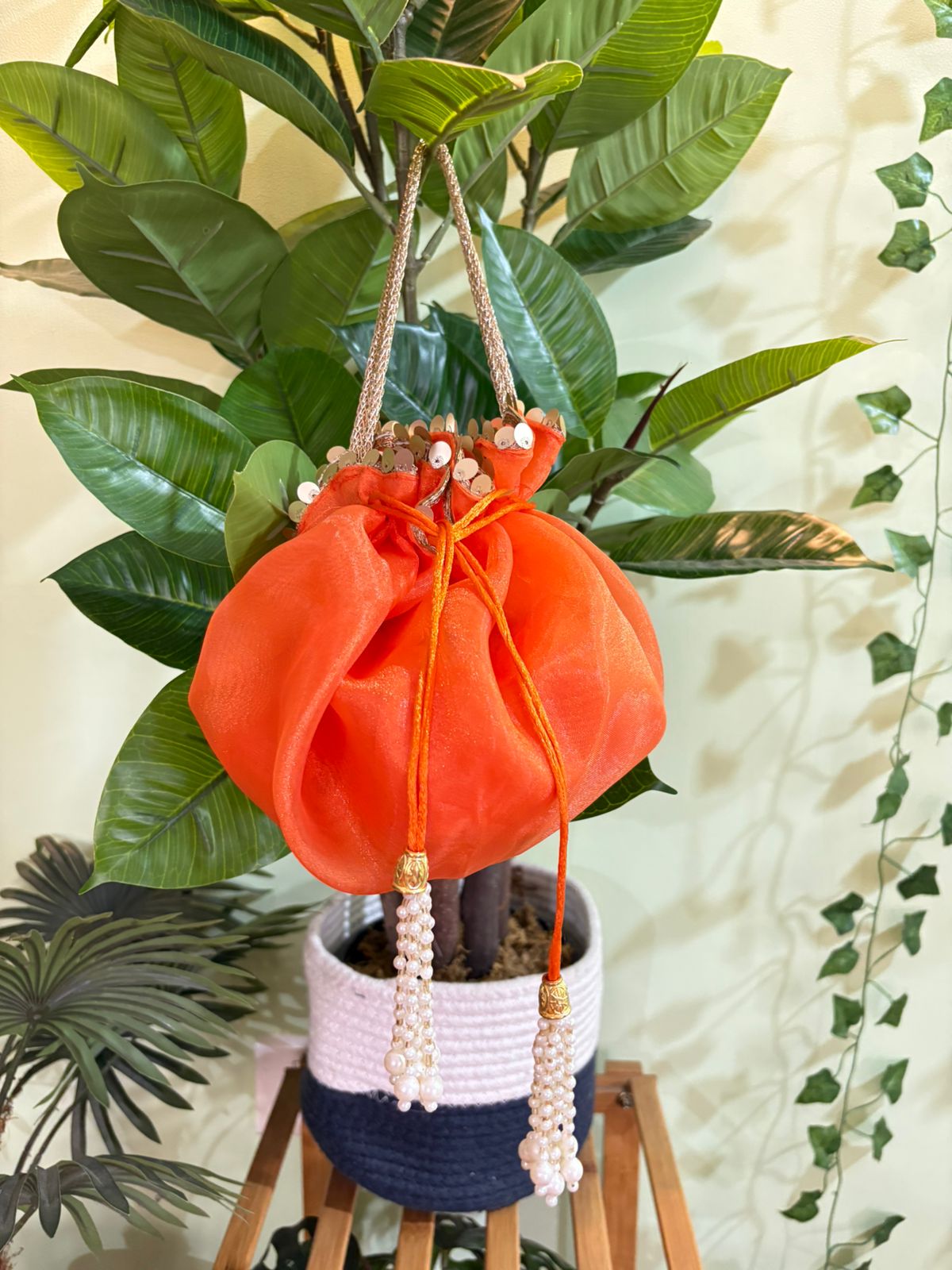 Scrunchy Organza potli with golden handle and golden sequins lace - Image 2