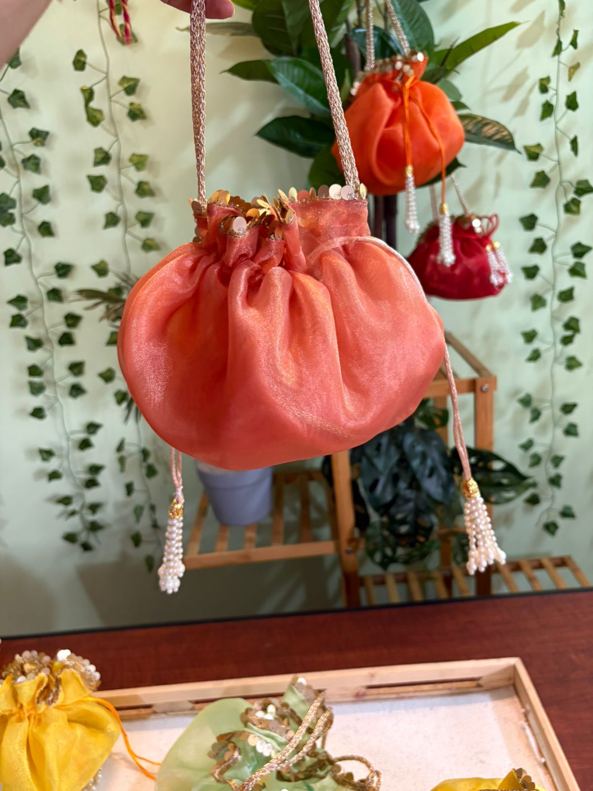 Scrunchy Organza potli with golden handle and golden sequins lace - Image 6