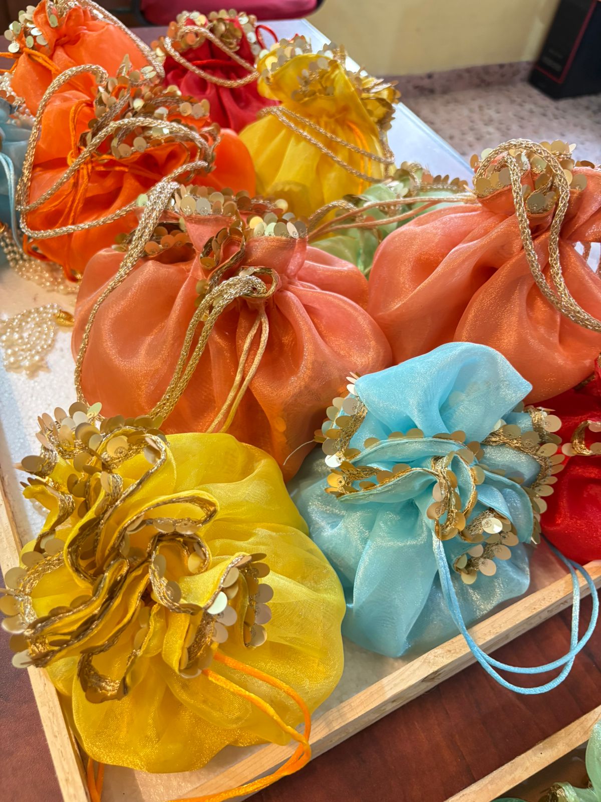 Scrunchy Organza potli with golden handle and golden sequins lace - Image 5